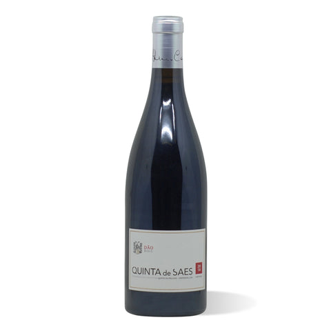 A dark wine bottle with a silver foil cap and a white label with red and black lettering