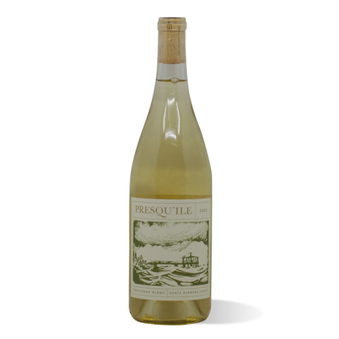 A clear wine bottle filled with white wine that's golden with green undertones.